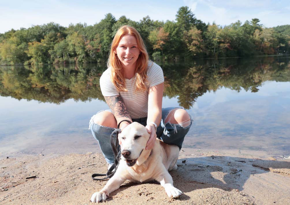 Portrait with a dog near a lake