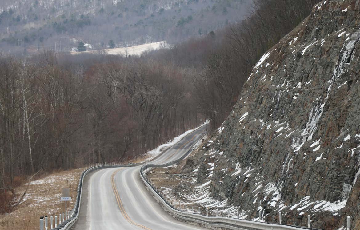 Winding road through a winter mountain landscape